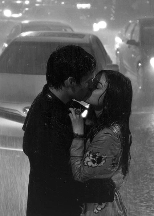Girl boy kissing in rain