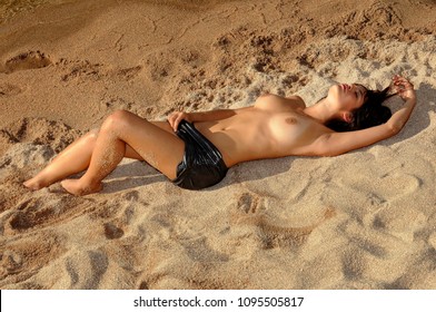 Sexy nude girl on beach