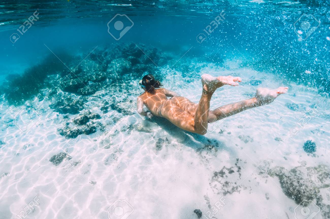 Girl nude underwater scuba diving
