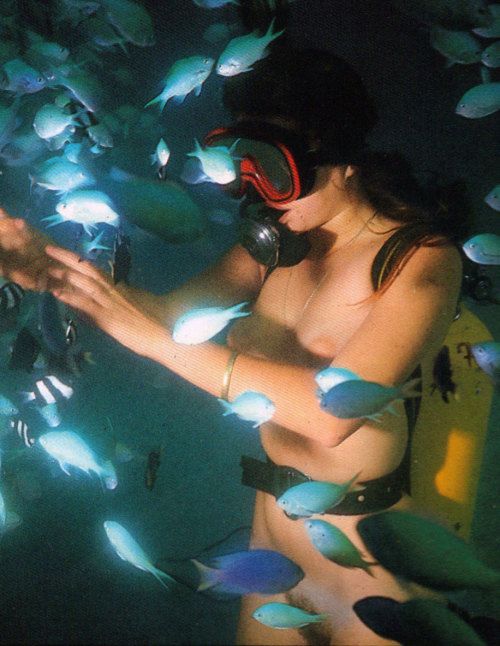 Nude underwater scuba diving